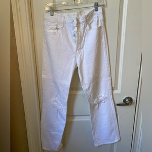 MOTHER white denim jeans in size 8 with ripped detailing